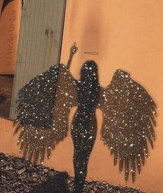 an instagram photo of a woman with glitter wings