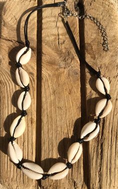 Handmade cowrie shell choker.  Fully adjustable (33-38cm) with cowrie shells strung on black waterproof cord.  Cowrie shells measure 17 x12 mm. 🌊 🏊✅ Pool & ocean proof.  📦✅ Shipped FREE in the UK and dispatched on the SAME DAY where possible. 🎁✅ Gift wrap option available.  Visit our Etsy site to view other Ben's Beach jewellery --> https://www.etsy.com/uk/shop/BensBeach 🌐 Visit our main site --> https://bensbeach.com/ to view our wider selection and subscribe for updates (we do not spam) re new jewellery and offers. Follow Ben on Instagram & Pinterest:  https://www.instagram.com/bensbeachjewellery/  https://www.pinterest.co.uk/6fccf3766a7720fb9faddadb150933/  See what other customers think of Ben's Beach by checking our reviews on Trust Pilot. https://uk.trustpilot.com/review/bensbea Beach Jewellery, Shell Choker, Cowrie Shells, Beach Boho, Jewellery Uk, Cowrie Shell, Shell Jewelry, Themed Jewelry, Holiday Jewelry