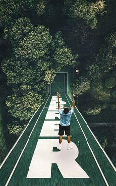 a man swinging a tennis racquet on top of a tennis court with trees in the background