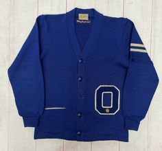 Vintage 1950s Colborns Letterman Varsity Wool Cardigan Sweater Jacket Blue. No Size label Condition is “Pre-Owned” Missing 1 button Ships with USPS PLEASE ASK ALL QUESTIONS FIRST! *Please advise: pictures are taken outdoors, natural light can sometimes change the balance. But I am taking photos as close to actual as possible!* PACKAGES USUALLY SHIP 1 OR SAME DAY-ORDERS ON FRIDAY AFTER 5 PM PST-WEEKEND- WILL SHIP MONDAY IF NO HOLIDAY. PLEASE MESSAGE FOR INTERNATIONAL PRICING. Check out all my oth Vintage Varsity Sweater, Vintage Blue Cotton Cardigan, Vintage Blue Outerwear For College, Retro Blue Long Sleeve Cardigan, Blue Retro Long Sleeve Cardigan, Blue Long Sleeve Vintage Cardigan, Retro Cotton Cardigan For College, Retro Cotton Cardigan, Vintage Blue Sweater For College