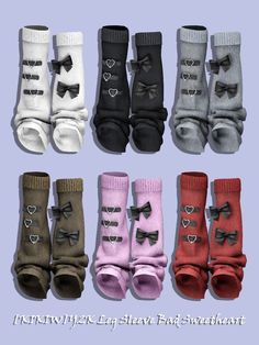 six pairs of baby socks with bows and hearts on them, all in different colors