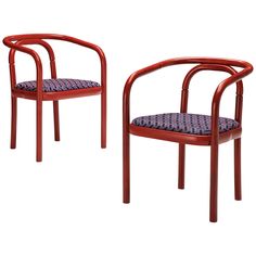 two red chairs sitting next to each other