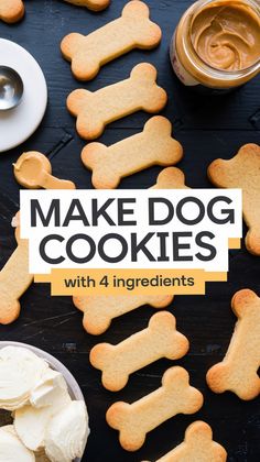 dog cookies with white frosting are on a table next to bowls and spoons