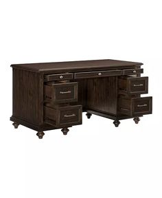 an office desk with drawers and wheels on the bottom drawer, in dark brown wood