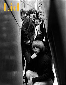 the rolling stones on an escalator with their arms around each other and looking down