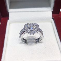 ONE OF A KIND DIAMOND & WHITE GOLD RING! SUGGESTED RETAIL VALUE: 3,950 HANDCRAFTED white gold ring! With super sparkling diamonds! Extremely white and clean! You will always be surprised by the sparkle! The middle part is designed to be an illusion of a 1.5 carat heart-shaped Diamonds (with 3 round brilliant diamonds). Set in 18K white gold ring! DIAMONDS: 48 Natural smaller, brilliant round diamonds weighting at 0.70 carat. All E/F (colorless) color, and VVS-VS quality Natural untreated dia Moissanite Heart Cut Diamond Ring For Proposal, Heart Cut Moissanite Diamond Ring For Proposal, Heart Cut Brilliant Diamond Proposal Ring, Diamond Heart Cut Ring For Proposal, Heart Cut Diamond White Ring For Proposal, Wedding Heart Ring With Halo Setting In Diamond White, Dazzling Heart Cut Diamond Ring Gift, Dazzling Heart Cut Diamond Ring As Gift, Wedding Jewelry With Brilliant Cut Double Heart