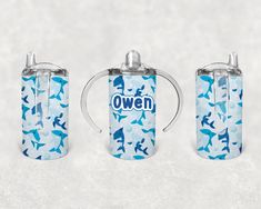 two blue and white cups with the words oven printed on them, sitting next to each other