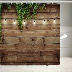 a shower curtain with lights on it and wood planks in the wall behind it