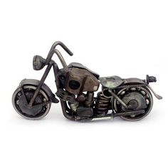 a metal model of a motorcycle on a white background