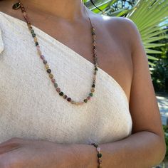 Wear our new tourmaline heart stone necklace and feel the power of Tourmaline's calming energy. This beautiful bracelet will be a constant reminder of the positive vibrations that Tourmaline brings. It will keep you balanced and grounded, while providing protection against bad vibes. Handmade with LOVE by talented artisans in Bali, Indonesia, so you may observe slight variations in color Multicolored Tourmaline heart-shaped beads Adjustable length for choker and princess look 16" extends to 18" Spiritual Tourmaline Gemstone Beads Jewelry, Spiritual Tourmaline Gemstone Bead Necklaces, Adjustable Tourmaline Gemstone Necklace, Spiritual Tourmaline Gemstone Bead Necklace, Healing Tourmaline Gemstone Necklace, Bohemian Tourmaline Round Bead Necklaces, Bohemian Tourmaline Bead Necklaces, Healing Tourmaline Gemstone Bead Necklaces, Tourmaline Necklace With Natural Stones And Round Beads