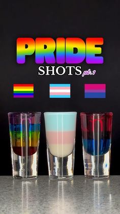 three shot glasses sitting next to each other on a counter top with the words pride shots over them