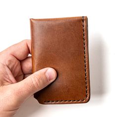 A durable bifold designed for front-pocket carry.The Vertical Wallet combines the classic bifold shape with a modern vertical style, making it perfect for front-pocket carry. Built to last a lifetime, the rustic full-grain leather not only endures the wear and tear of daily use but actually improves with age. Whether you're enjoying a night out at a craft brewery or tackling weekend projects, this wallet fits seamlessly into your lifestyle. Accidental drops, steps, or even being run over won't d Moleskine Cover, Full Grain Leather Wallet, Fisher Space Pen, Space Pen, Notebook Refill, Leather Mouse, Leather Mouse Pad, Oxblood Leather, Billfold Wallet