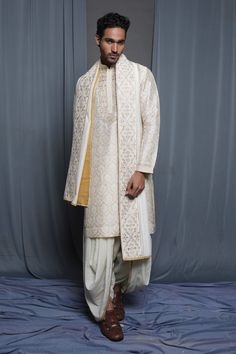 Ecru chanderi stole with floral embroidered border.
Pattern: Embroidered
Type Of Work: Floral
Fabric: Chanderi
Color: Cream
Other Details: 
Note: Pant and kurta worn by the model is not for sale
 - Aza Fashions Beige Sherwani With Dupatta Traditional Drape, Cream Embroidered Sets With Traditional Drape, Cream Raw Silk Kurta With Traditional Drape, Unstitched Tussar Silk Sherwani For Wedding, Traditional Tussar Silk Sherwani For Wedding, Ceremonial Off White Chikankari Embroidery Sets, Traditional Drape Tussar Silk Sherwani For Wedding, Ceremonial Off White Sets With Chikankari Embroidery, Designer Cotton Silk Bandhgala With Dupatta