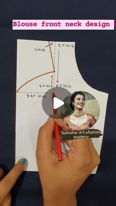 a person holding a pencil in front of a piece of paper with an image of a woman on it