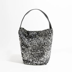 Elevate Your Style with Luxury Sparkling Sling Hobo Evening Purse Get ready to dazzle and shine with our Luxury Sparkling Sequin Ladies Sling Hobo Evening Purse! This exquisite handbag is a true fashion statement, designed to make you stand out in any crowd. With its glittering sequin exterior and big fashion bucket shopper tote design, it's the perfect accessory for trendsetters. Key Features: Versatile Occasion: This purse is perfect for a wide range of occasions, from glamorous evening parties to casual outings with friends. Interior Organization: It features a convenient cell phone pocket and interior zipper pocket to keep your essentials organized and easily accessible. Soft and Stylish: The soft construction of this hobo purse makes it comfortable to carry, while the sequined decorat Evening Bags With Sequins For Party Season, Trendy Evening Bag With Glitter, Chic Glitter Shoulder Bag For Evening, Chic Sequined Shoulder Bag For Party, Glamorous Evening Shoulder Bag With Sequins, Glamorous Evening Bucket Bag, Trendy Glitter Evening Bag, Sequin Bags For Night Out And Party Season, Glamorous Evening Bags For Summer