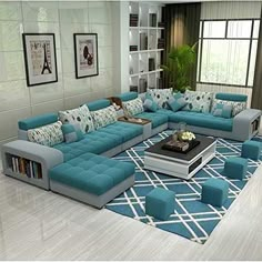 a living room filled with lots of blue couches and pillows on top of a rug