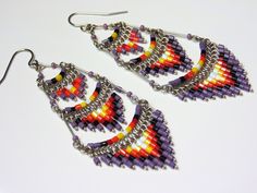 These gorgeous earrings were hand beaded in Peru. They measure 3 inches in length, 1 inch in width, with surgical steel ear wires. Dangle Beaded Earrings For Festivals With Ear Wire, Dangle Beaded Earrings With Ear Wire For Festivals, Dangle Beaded Earrings For Festivals, Festival Dangle Beaded Earrings With Ear Wire, Festival Beaded Dangle Chandelier Earrings, Festival Chandelier Earrings With Round Beads, Traditional Multicolor Beaded Earrings Nickel Free, Handmade Teardrop Chandelier Earrings For Festivals, Traditional Teardrop Chandelier Earrings With Dangling Beads