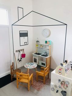 a small kitchen and dining area in a child's playroom