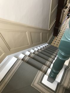 there is a set of stairs leading up to the second floor