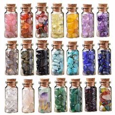 many different colored stones in glass bottles