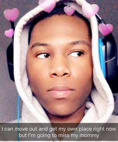 a young man wearing headphones with pink hearts on his ears and the caption i can move out and get my own place right now, but i'm going to miss