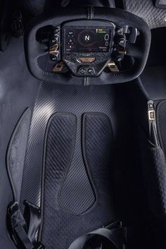 the interior of a sports car with black leather