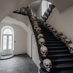 a bunch of skulls that are on some stairs