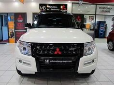 a white pick up truck in a showroom