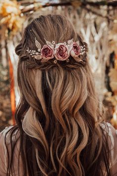 a woman with long hair and flowers in her hair