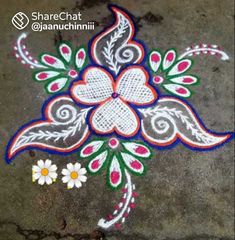 an artistic design on the ground with flowers