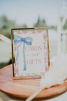 a card that says cards are my gifts on top of a wooden table with feathers