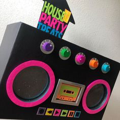 there is a boombox that has different colored buttons on the front and side of it