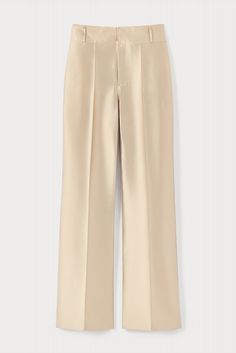 The Beige Satin Flared Pants are the perfect high-waisted pant. These fitted trousers have a straight flared cut with a cropped hem. DESTREE reimagines the classic beige with its subtle iridescent color. Trousers crafted in a blend of silk and polyester. Body-fitted High-waisted Straight flared cut Cropped length Concealed zip closure Pressed front crease Gul Hurgel, Brand Manifesto, Adriana Degreas, Iridescent Color, Flared Pants, Fitted Trousers, New Arrival Dress, Knit Jacket, Body Fit