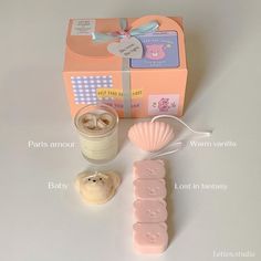 the contents of a baby shower gift set including soap, toothbrush, and cup