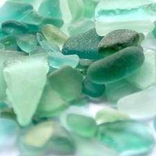 green and blue sea glass on the beach