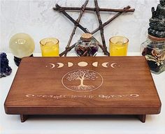 a wooden table topped with bottles and glasses next to a pentagramter's wheel