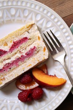 a piece of cake on a plate with fruit