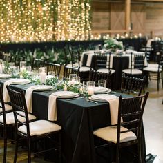 tables with black linens and white tablecloths are set up for an event