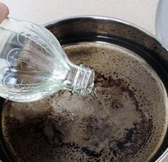 a person is pouring water into a pot filled with dirt