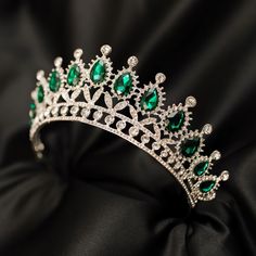 Saya's Tiara features green colored crystals with clear colored crystal detailing set into silver colored metal. Max Height: 2.5 Inches Length End to End: 14.5 Inches Length of Embellishment: 10.5 Head Opening: 5 Inches Tiara is adjustable by carefully bending and stretching the ends apart to fit most hair styles and head sizes. Tiara features loops on each end to secure to hair with bobby pins. Item ships from Michigan, USA. WARNING: CHOKING HAZARD This is not a toy. This item is not intended f Fantasy Crowns, Fantasy Crown, Cute Promise Rings, Wedding Jewelery, Tiaras Jewellery, Emerald Wedding, Michigan Usa, Harry Winston, Wedding Tiara