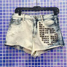 Bdg High Waisted, Cheeky Denim Shorts From Urban Outfitters. Purchased As Shown With Silver Embellishment Studs That Form The Shape Of A Cross And Dip Bleached. Basically Brand New As They Have Only Been Worn A Handful Of Times And Are In Great Condition. All Orders Shipped The Same Or Next Business Day! Edgy Faded Bottoms For Spring, Edgy Cotton Bottoms For Summer, Edgy Light Wash Mid-rise Bottoms, Edgy Washed Bottoms For Spring, Edgy Denim Shorts For Summer, Trendy Faded Distressed Bottoms, Trendy High Waist Washed Bottoms, Trendy Acid Wash Mid-rise Bottoms, Grunge High-waisted Shorts For Summer