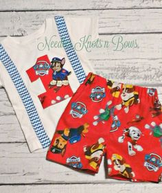 two pieces of red and white clothing with mickey mouses on them, one has blue trim