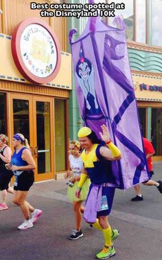 people are running in a marathon with a purple kite on their back and the caption reads, the best costume - designed at disney land's 101k race today