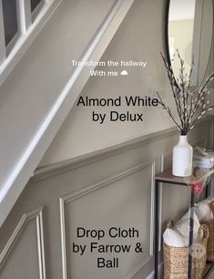 a white vase sitting on top of a wooden shelf next to a mirror and stairs