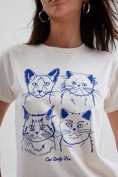 Purrrfect graphic tee featuring a graphic of four cats across the front. Designed in a slim fit & cropped length for an effortless look. Only at Urban Outfitters. Features Cat Lady Era slim graphic tee Fitted graphic tee Soft and stretchy knit Crew neckline and short sleeves Four cats and Cat Lady Era graphic across the front Slim fit Cropped length Easy pull-over style UO exclusive Content + Care 100% Cotton Machine wash Imported Size + Fit Model in White is 5’9.5" and wearing size Small Measur Four Cats, Men's Shoes Accessories, Top Graphic Tees, Women Men Shoes, Jeans For Sale, Cat Lady, Tee Shop, Women's Style, Graphic Tee