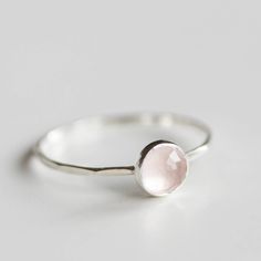 Tiny skinny stackable ring with a beautiful rose cut rose quartz gemstone. It is made with a skinny but sturdy band, which allows you to create mind-blowing stacking sets! The ring is ideal for everyday wear and it will also look amazing with a festive dress. The ring is 0,8-0,9 mm thick and looks very dainty on the finger. Choose the stone (3mm smooth or 5 mm rose cut and smooth) and the material for the ring (sterling silver or 9k gold). If you want to change the ring band design or get a cust Minimalist Pink Stackable Rings For Everyday, Elegant Stackable Rose Quartz Jewelry, Minimalist Faceted Stackable Rings, Minimalist Adjustable Pink Stackable Rings, Minimalist Pink Gemstone Stackable Rings, Festive Dress, Band Design, Rose Quartz Gemstone, Stackable Ring