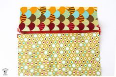 three pieces of fabric with circles and dots on them, one is yellow and the other is brown