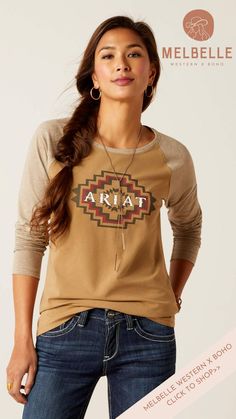 Elevate your casual wardrobe with the Ariat Tucson Baseball Tee in Petrified Oak. A perfect fusion of timeless design and contemporary comfort, this tee is your go-to choice for effortlessly stylish and relaxed days. The Ariat Tucson Baseball Tee draws inspiration from the timeless baseball tee silhouette. With its contrasting raglan sleeves and classic crew neck, it adds a sporty yet sophisticated touch to your everyday look. Baseball Tee Shirts, Western Graphic Tees, Playsuit Romper, Print Graphic, Long Sleeve Tee Shirts, Wide Fit Boots, Love T Shirt, Baseball T Shirt