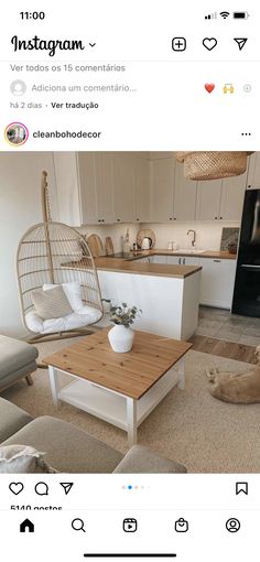 a living room with a birdcage on the coffee table and a dog laying on the floor