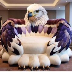 an eagle statue sitting on top of a white chair